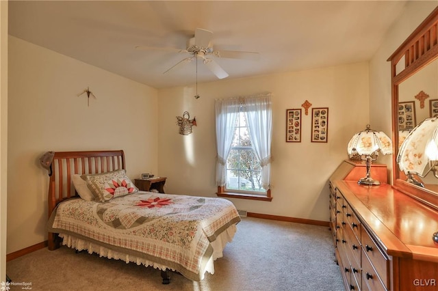 bedroom featuring light carpet and ceiling fan