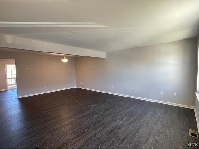 unfurnished room featuring dark hardwood / wood-style floors