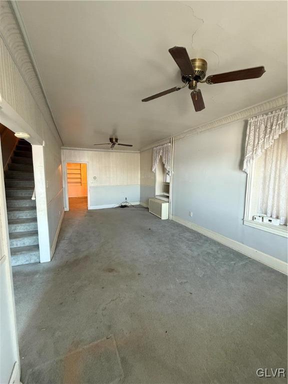 unfurnished living room featuring carpet floors