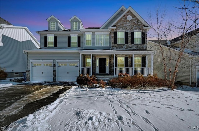 view of front of home with a garage and covered porch