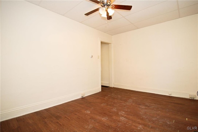 unfurnished room with dark hardwood / wood-style floors and ceiling fan