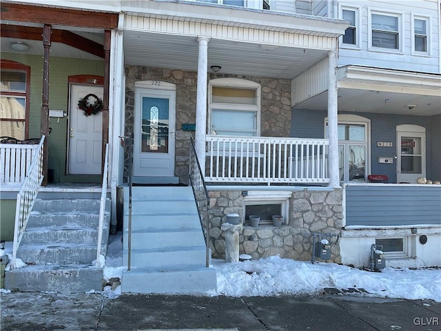 view of snow covered property entrance