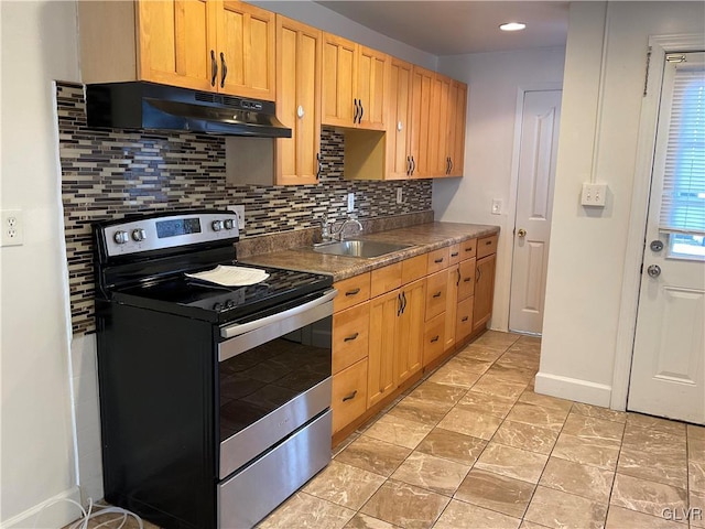 kitchen featuring stainless steel electric range oven, sink, and backsplash