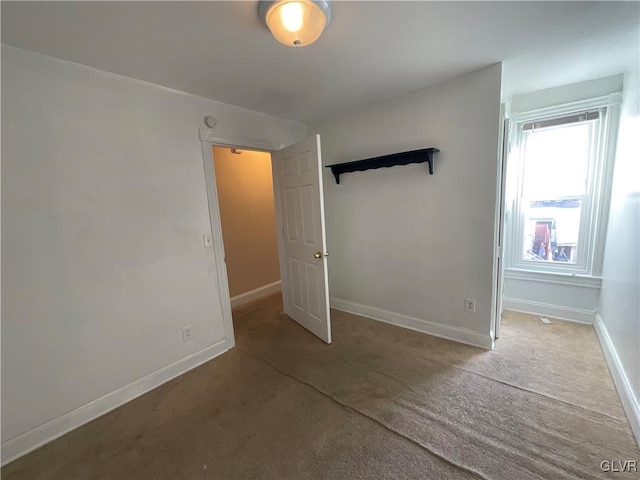 unfurnished bedroom featuring carpet flooring