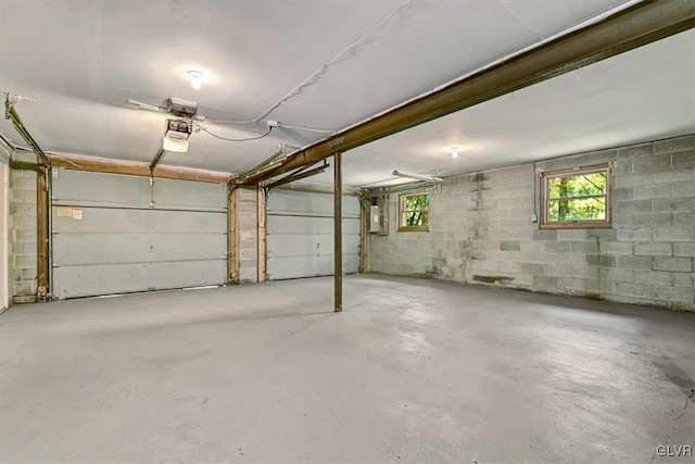 garage featuring a garage door opener and electric panel