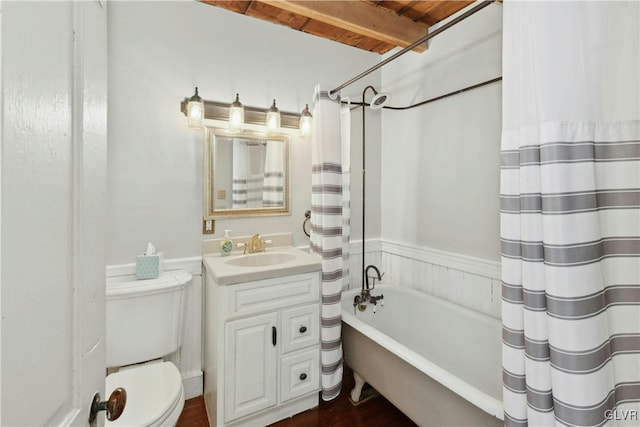 full bathroom with vanity, toilet, and shower / bath combo with shower curtain