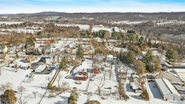 snowy aerial view with a mountain view