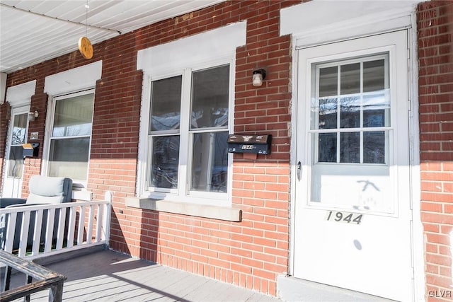 property entrance featuring covered porch