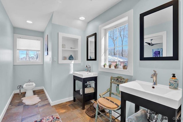 bathroom featuring a bidet, vanity, and built in features