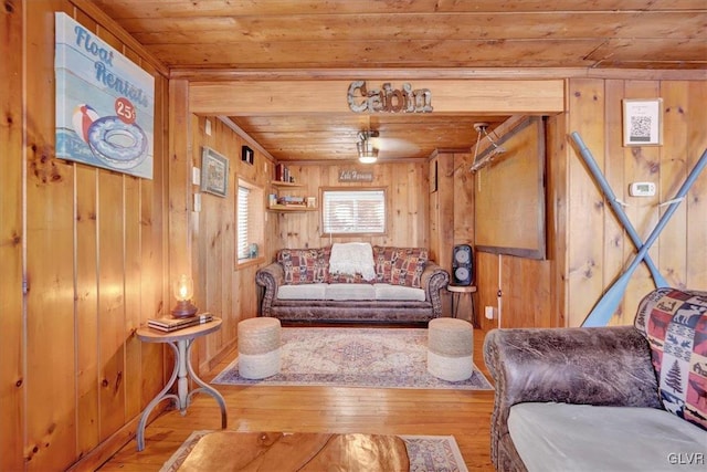 living room featuring wood-type flooring, wooden walls, and wooden ceiling