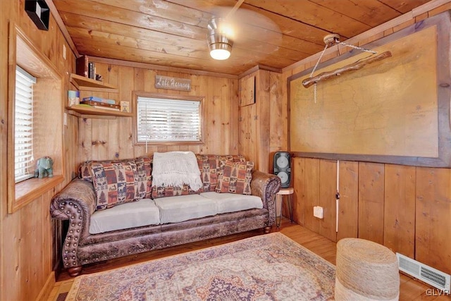 interior space featuring wood ceiling, light hardwood / wood-style floors, and wood walls