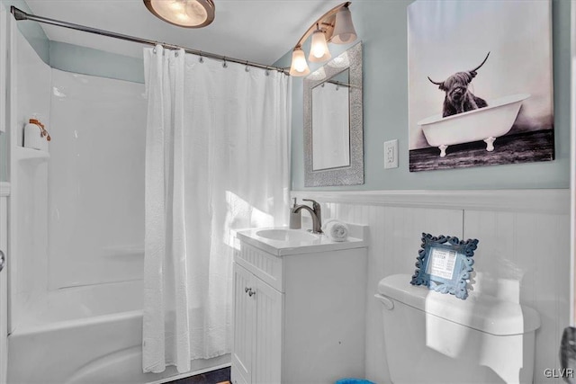 full bathroom featuring vanity, toilet, and shower / bath combo with shower curtain