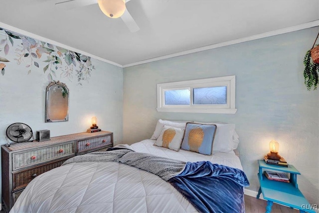 bedroom featuring crown molding, ceiling fan, and hardwood / wood-style flooring