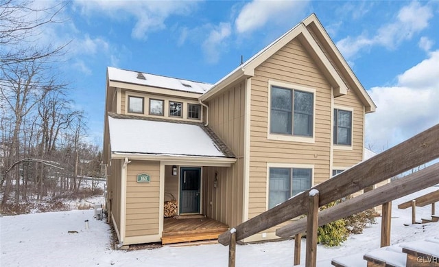 view of snow covered house