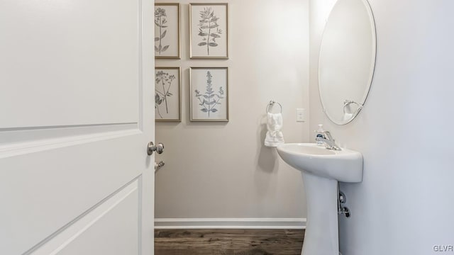 bathroom with hardwood / wood-style flooring