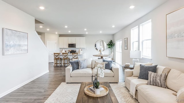 living room with light hardwood / wood-style flooring