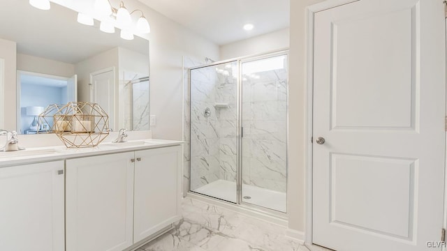 bathroom with walk in shower and vanity