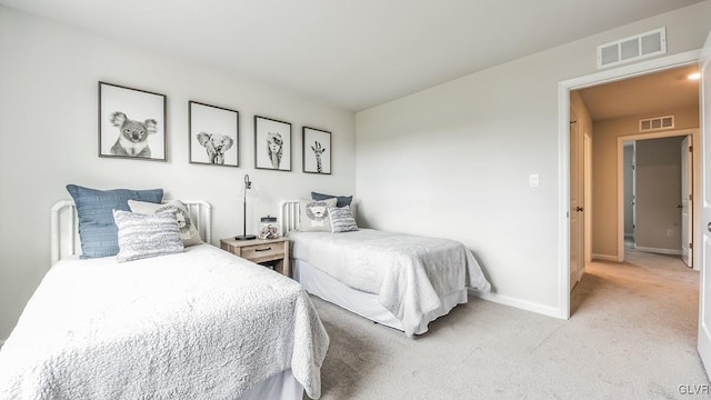 bedroom with light colored carpet