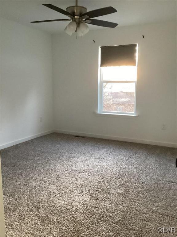 unfurnished room featuring carpet floors and ceiling fan