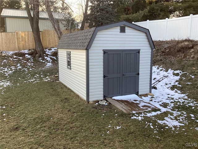 snow covered structure featuring a lawn