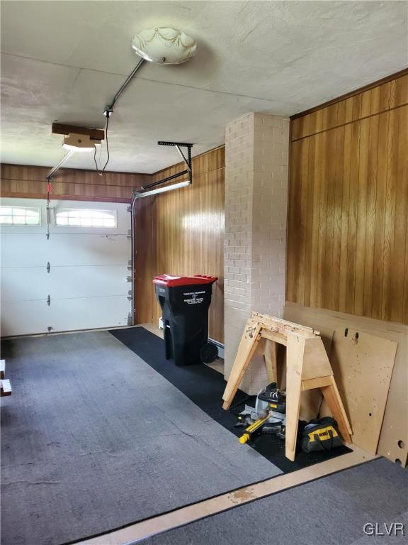 garage with wood walls