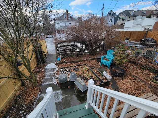 view of yard featuring a residential view and fence