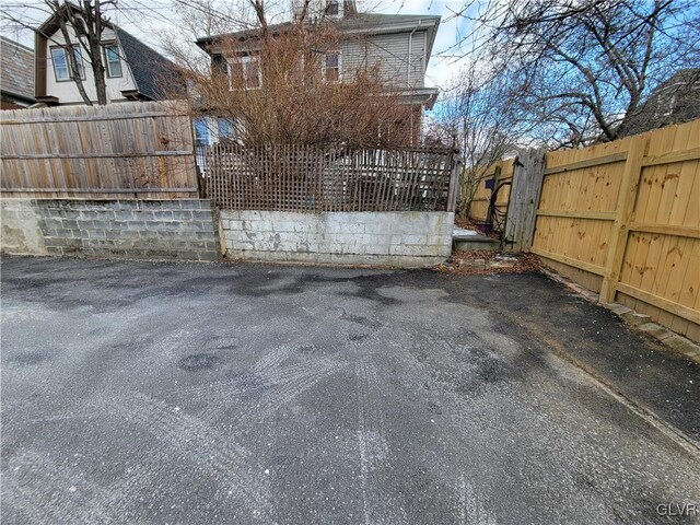 view of gate with fence