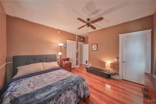 bedroom featuring wood finished floors and a ceiling fan