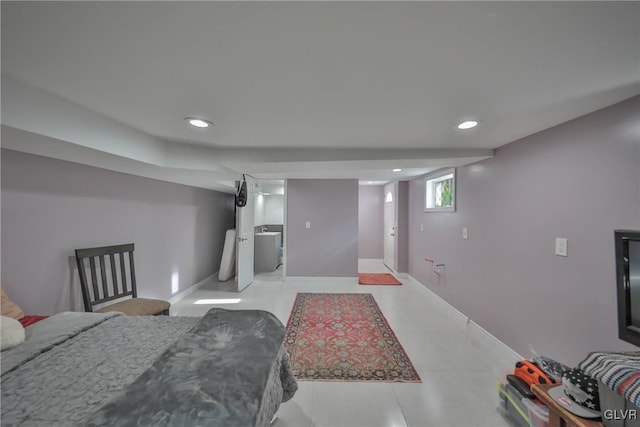 basement with recessed lighting, baseboards, and tile patterned floors