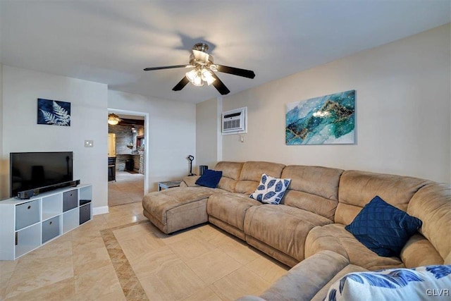 tiled living room with ceiling fan and an AC wall unit