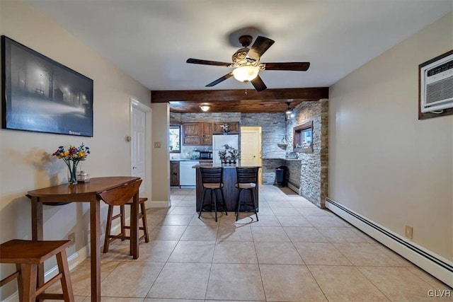 kitchen featuring white appliances, a baseboard heating unit, a kitchen bar, a center island, and light tile patterned flooring