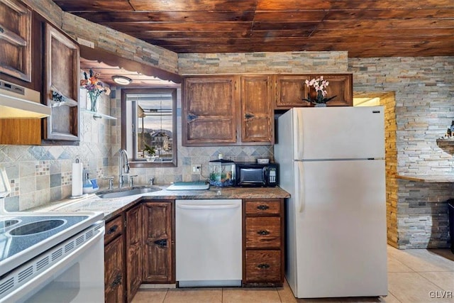 kitchen featuring sink, light tile patterned floors, wooden ceiling, and white appliances