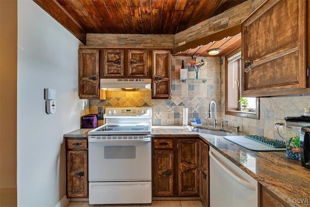 kitchen with sink, light tile patterned floors, wooden ceiling, white appliances, and light stone countertops