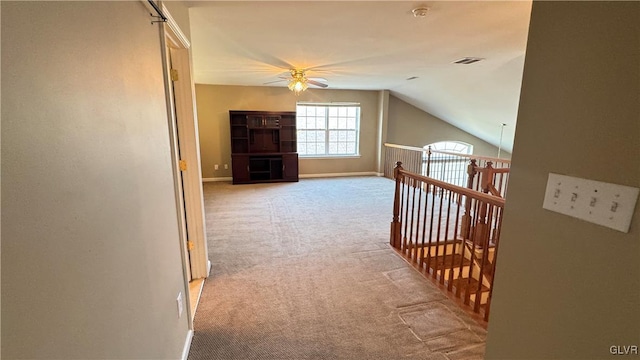 additional living space featuring light carpet, vaulted ceiling, and ceiling fan