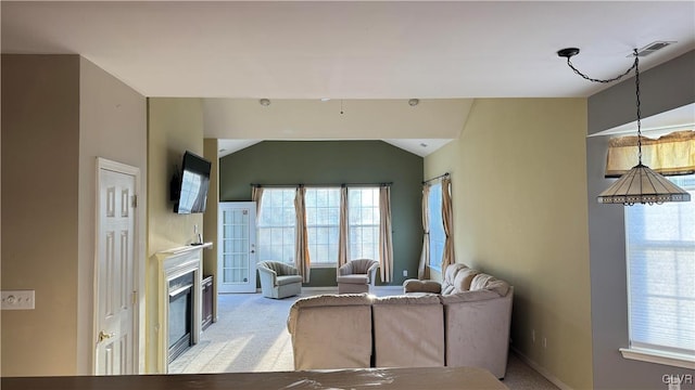 living room featuring lofted ceiling and light carpet