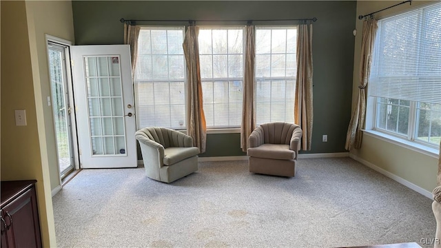 living area with light colored carpet