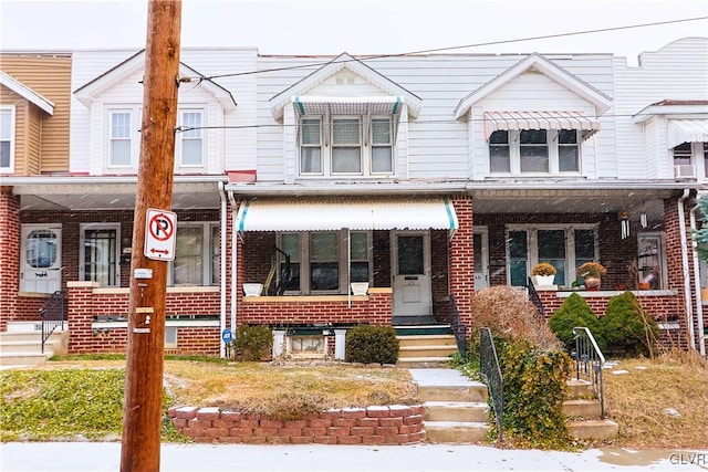 view of property featuring a porch