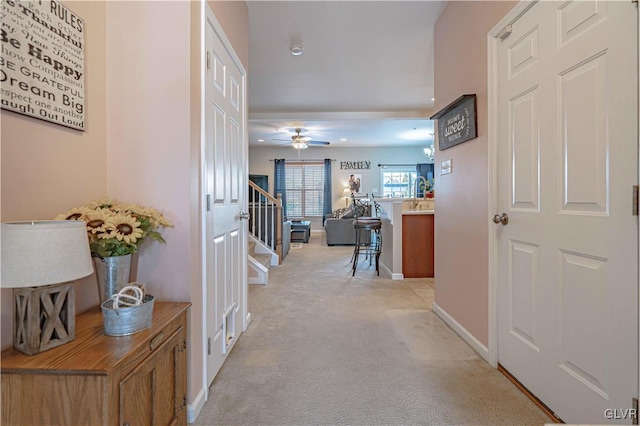 corridor with light colored carpet