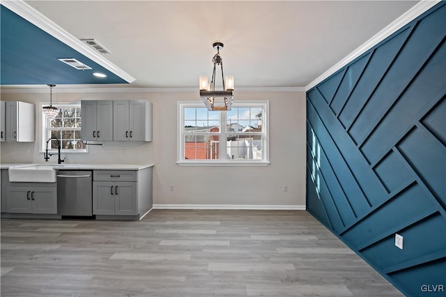 kitchen featuring an inviting chandelier, gray cabinets, dishwasher, and decorative light fixtures