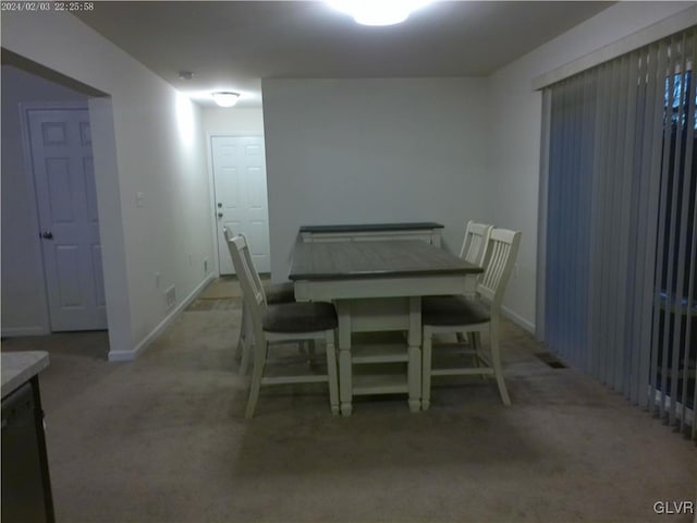 view of carpeted dining area