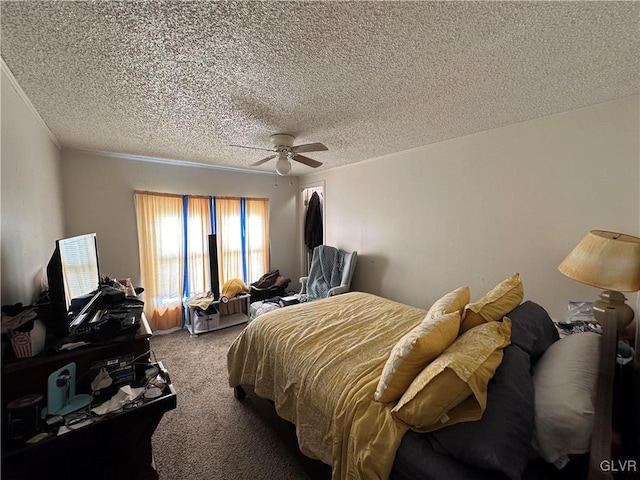 carpeted bedroom with ceiling fan and a textured ceiling