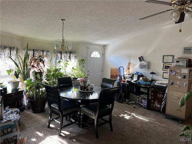 dining area featuring ceiling fan, a textured ceiling, and dark colored carpet