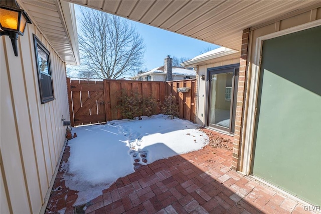 view of snow covered patio