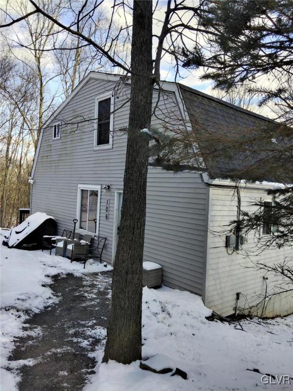 exterior space featuring a gambrel roof