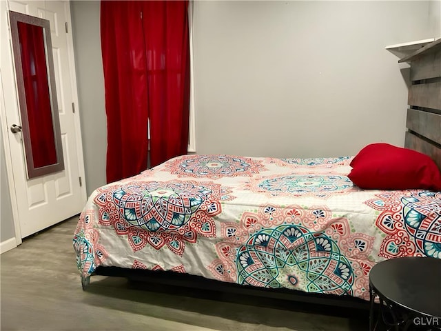 bedroom featuring wood finished floors