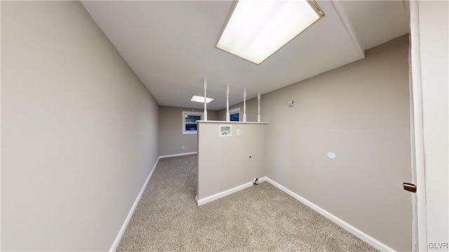 laundry room featuring washer hookup and light colored carpet