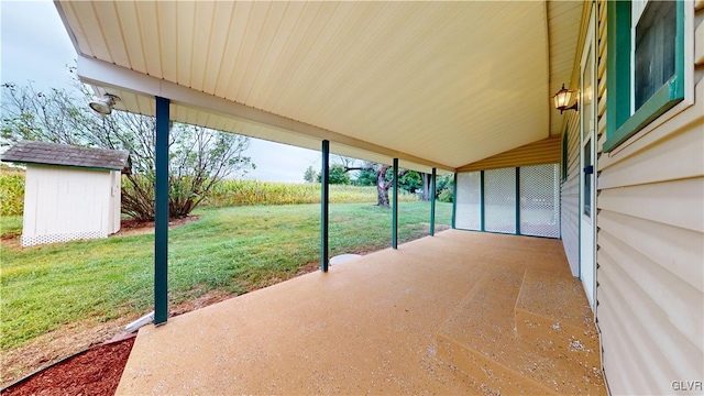 view of patio / terrace featuring a storage shed