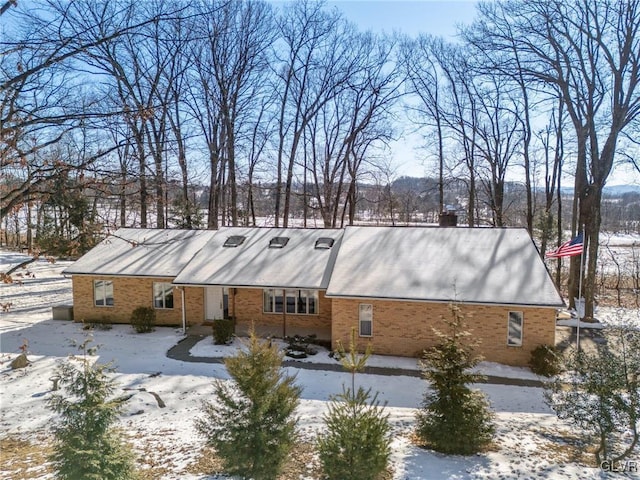 view of snow covered house