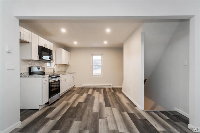 kitchen with white cabinetry, decorative backsplash, a baseboard heating unit, light stone counters, and electric stove