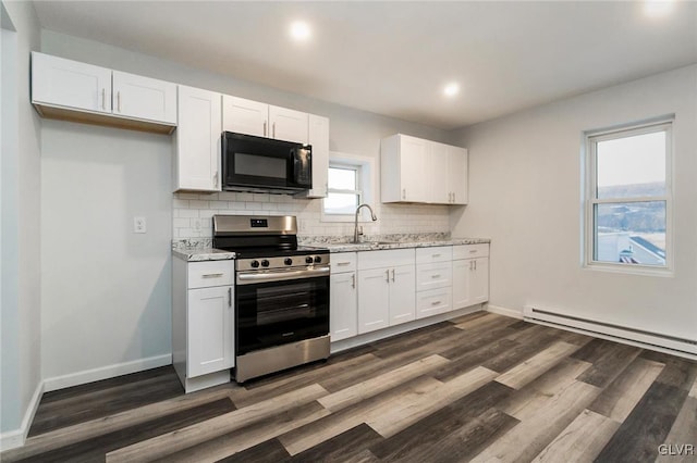 kitchen with sink, white cabinets, and stainless steel electric range